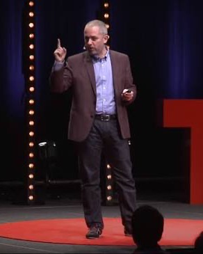 Photo of the person quoted, speaking on stage.